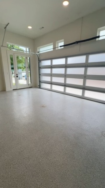Elite Garage Door Services of Northwest ArkansasA clean, spacious garage interior with a large, modern overhead garage door, highlighting the potential for garage door installation or repair services in Northwest Arkansas.…