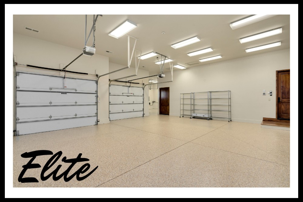 Why Regular Garage Door Tune-Ups Save You Money-3 Elite Garage Door Services of Northwest Arkansas-A spacious, well-lit garage with two overhead garage doors and clean flooring, suitable for residential use in Northwest Arkansas. Elite Garage Door offers professional and reliable garage door service and installation in this area.