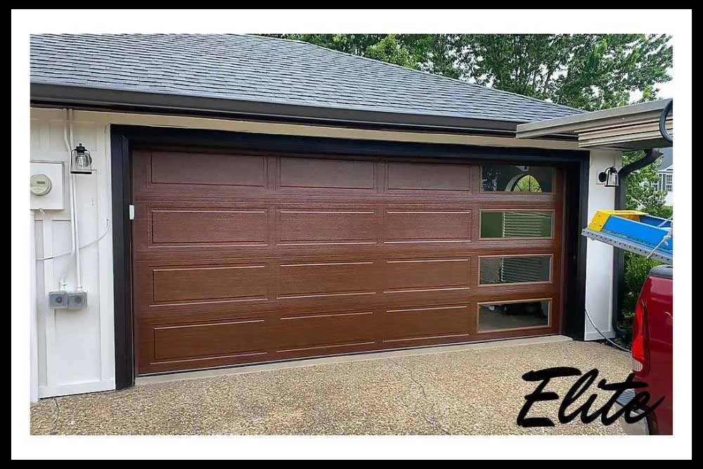 What-to-Do-When-A-Storm-Damages-Your-Garage-Door-4 Homeowner performing summer garage door maintenance to prevent storm damage in NWA